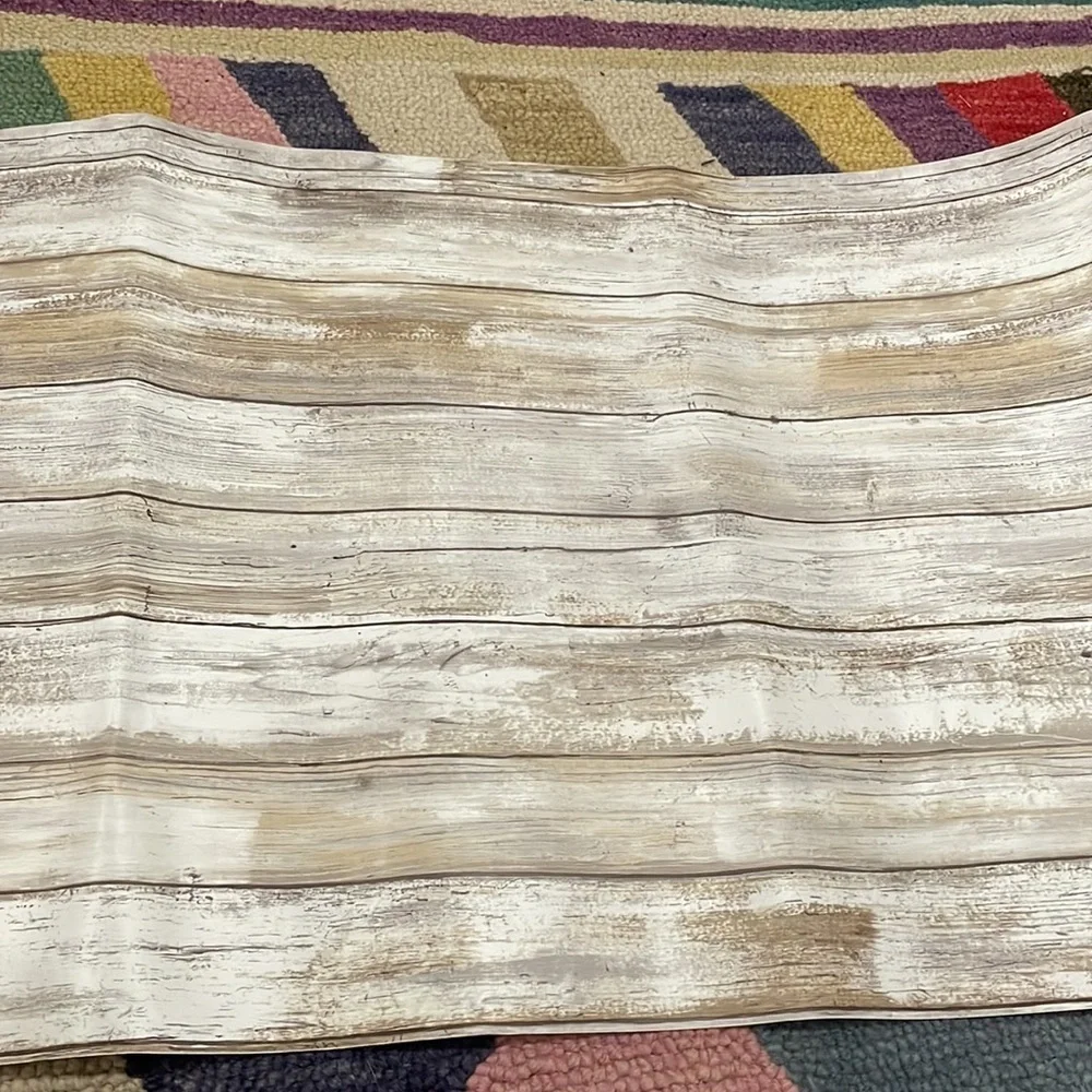 Two rolls of faux wood removable wallpaper